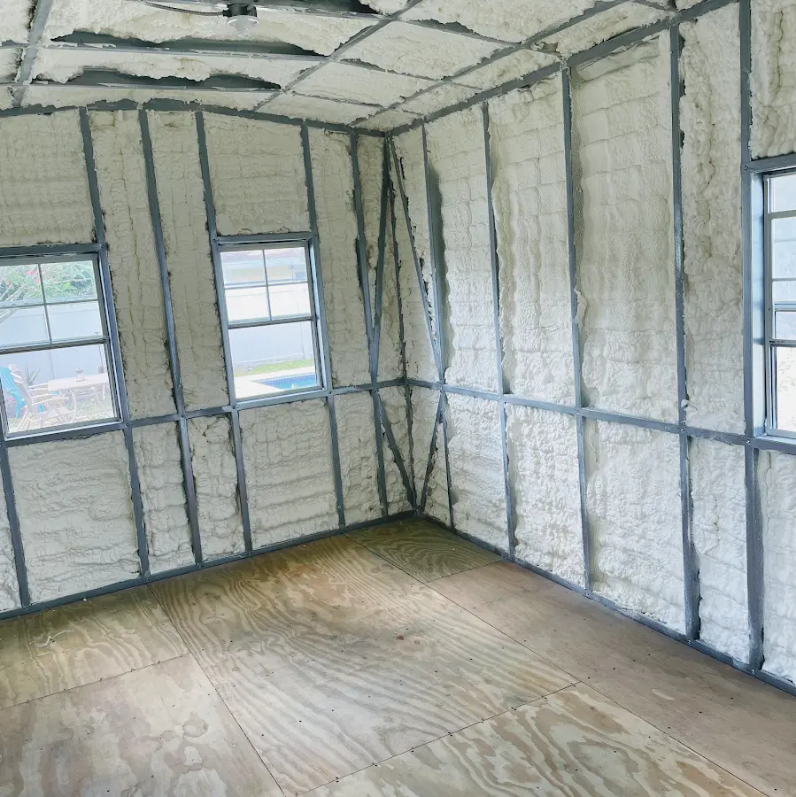 Closed-cell spray foam insulation applied to wall cavities in a residential project in Lake St. Louis